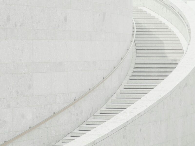 a man riding a skateboard down a set of stairs