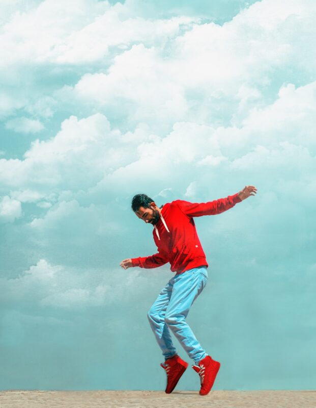 man wearing red pullover jacket