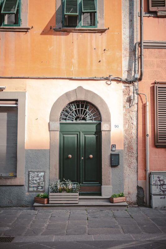 Photo by Gonzalo Facello a building with a green door and window